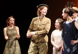 A group of teens acting in a play